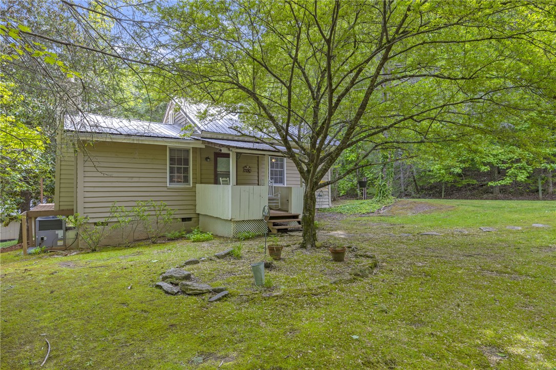 437 West Gate Road Pickens, SC 29671 - Photo 2 of 47 This charming home features a lovely front porch and a lush green yard.