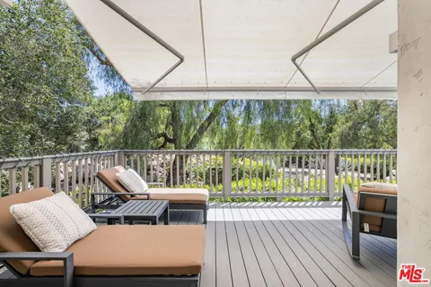 an aerial view of house with an outdoor space swimming pool