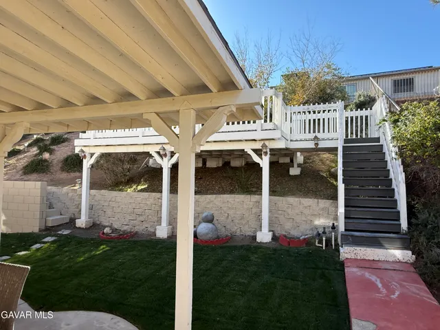 a balcony view with a hardwood floor