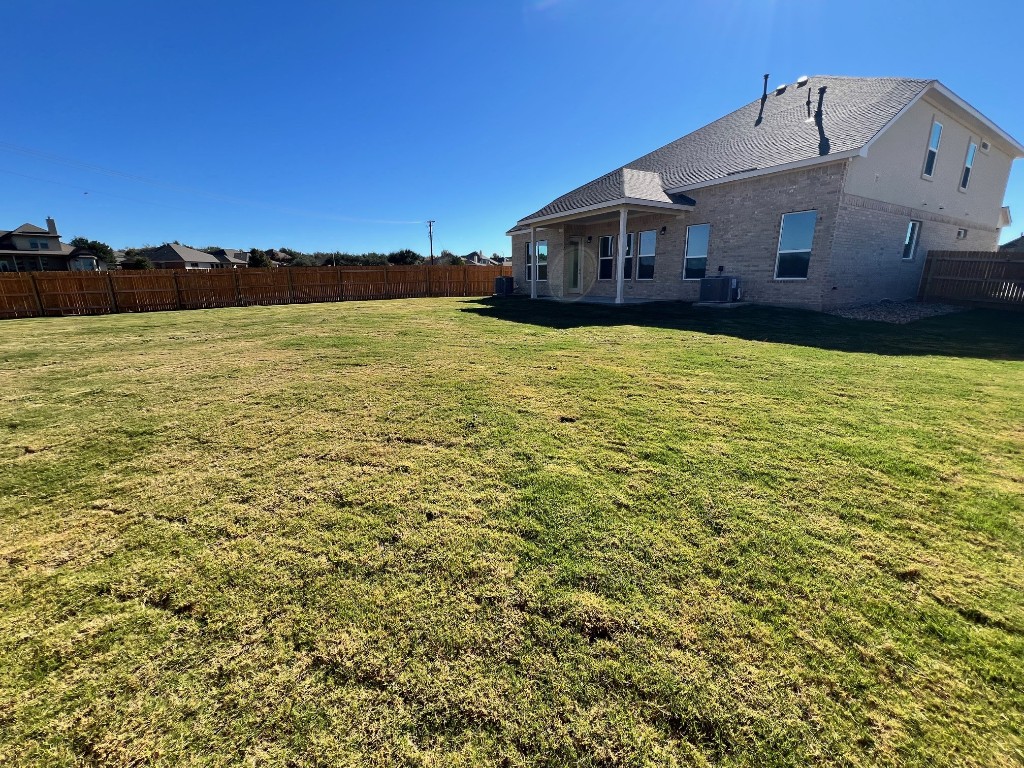 512 Prairie Wind Drive Leander, TX 78641 - Photo 8 of 10 a view of a house with a yard