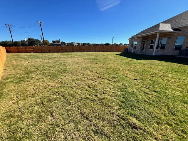a view of a swimming pool with chairs