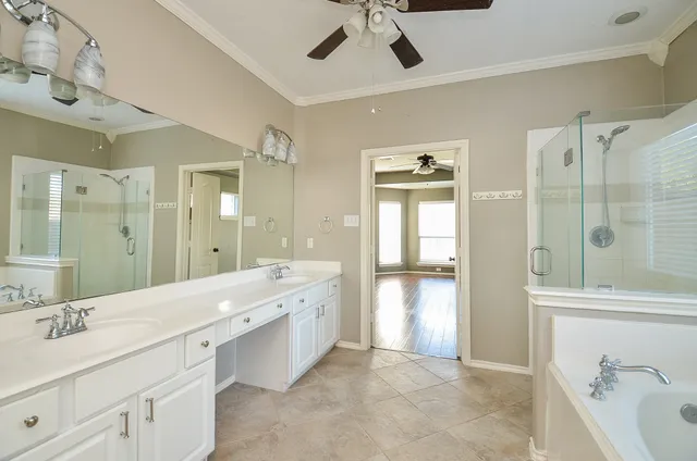 a white bath tub sitting next to a window