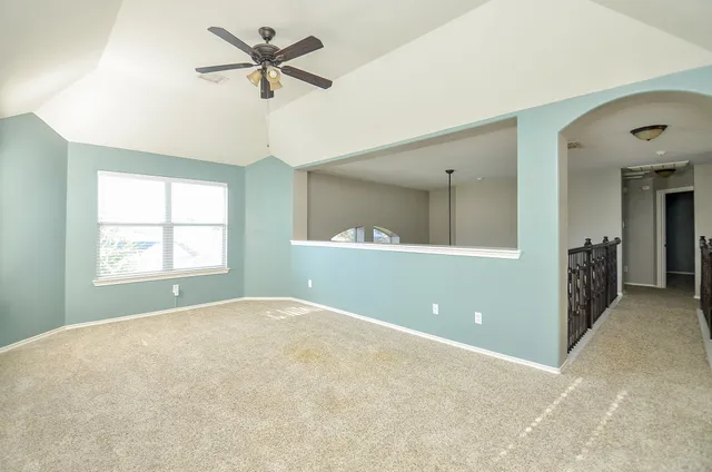 a view of an empty room and window