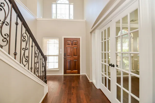 a view of an entryway with wooden floor