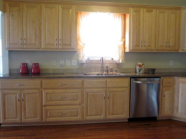 1017 Jump Off Road Bon Aqua, TN 37025 - Photo 8 of 18 a kitchen with granite countertop white cabinets stainless steel appliances and a window