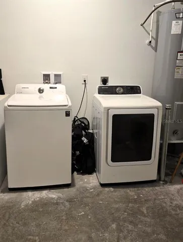 a utility room with dryer and washer