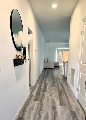 a view of livingroom with furniture and wooden floor