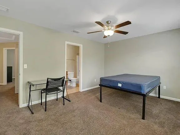 a room with wooden floor and pool table