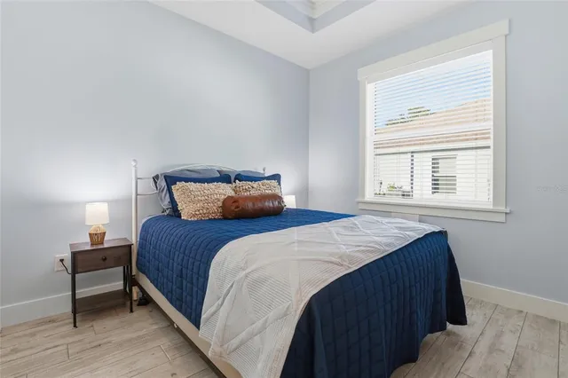 a bedroom with a bed and window