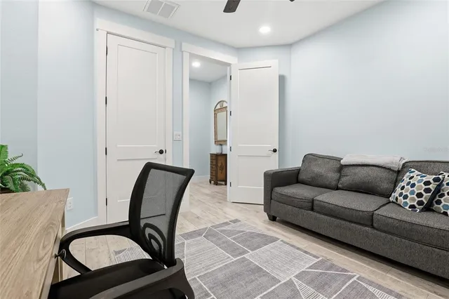 a living room with furniture and a stove