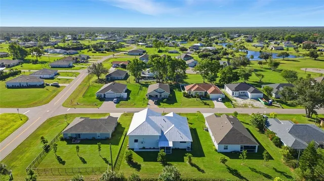 an aerial view of a house with a garden