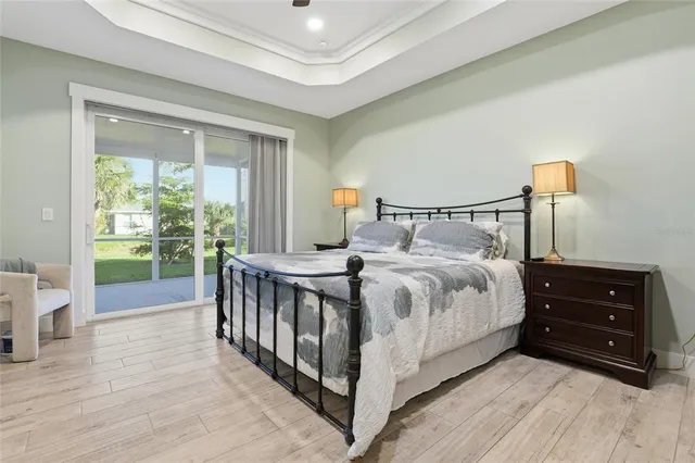 a bedroom with a bed and a tv