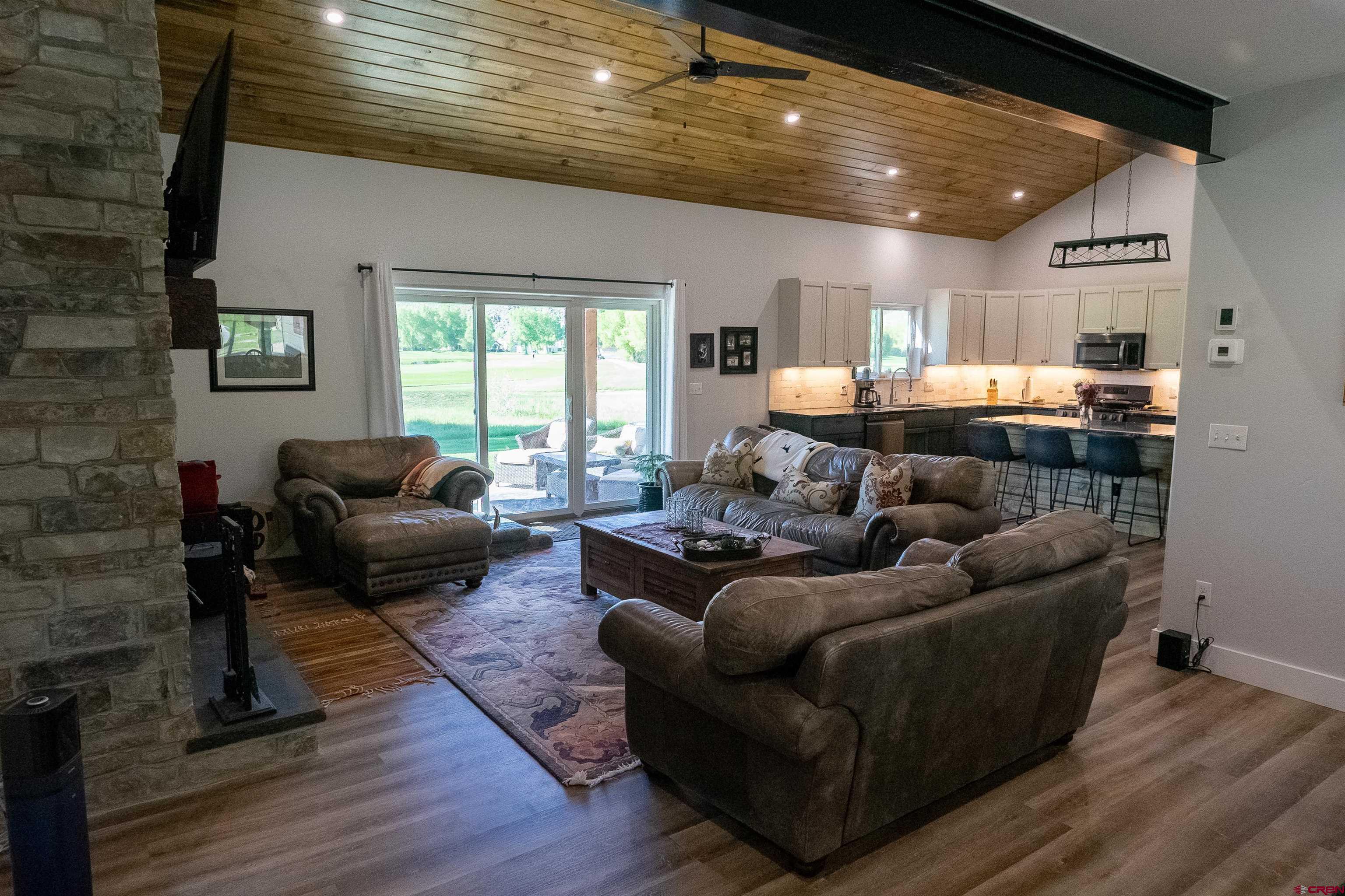 382 Tomichi Trail Gunnison, CO 81230 - Photo 12 of 34 a living room with furniture and a large window