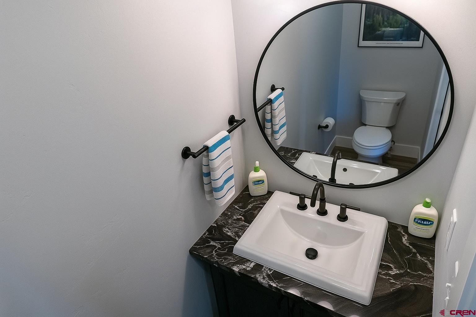 382 Tomichi Trail Gunnison, CO 81230 - Photo 22 of 34 a bathroom with a sink and mirror