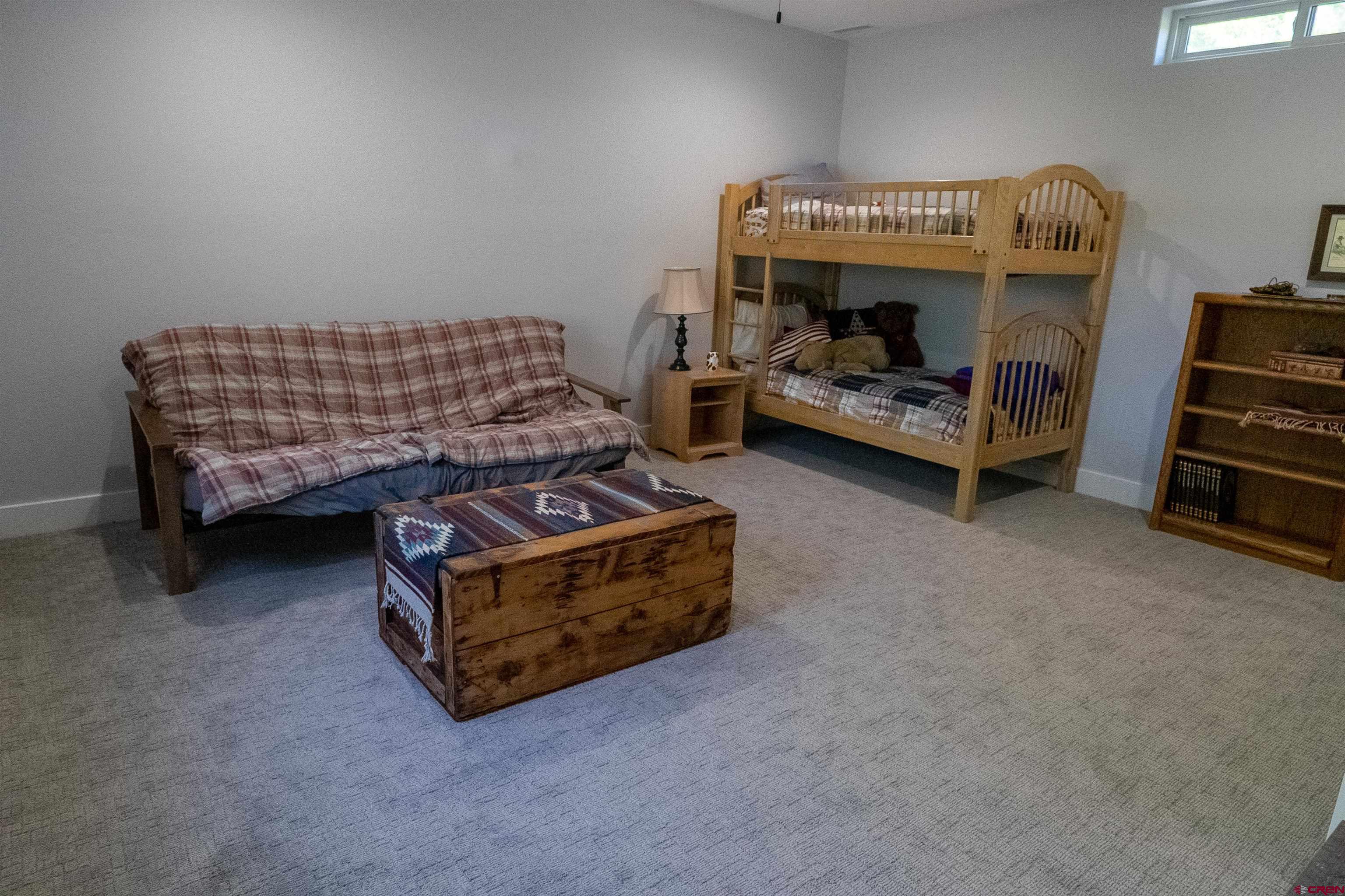 382 Tomichi Trail Gunnison, CO 81230 - Photo 25 of 34 a bedroom with furniture and a baby crib