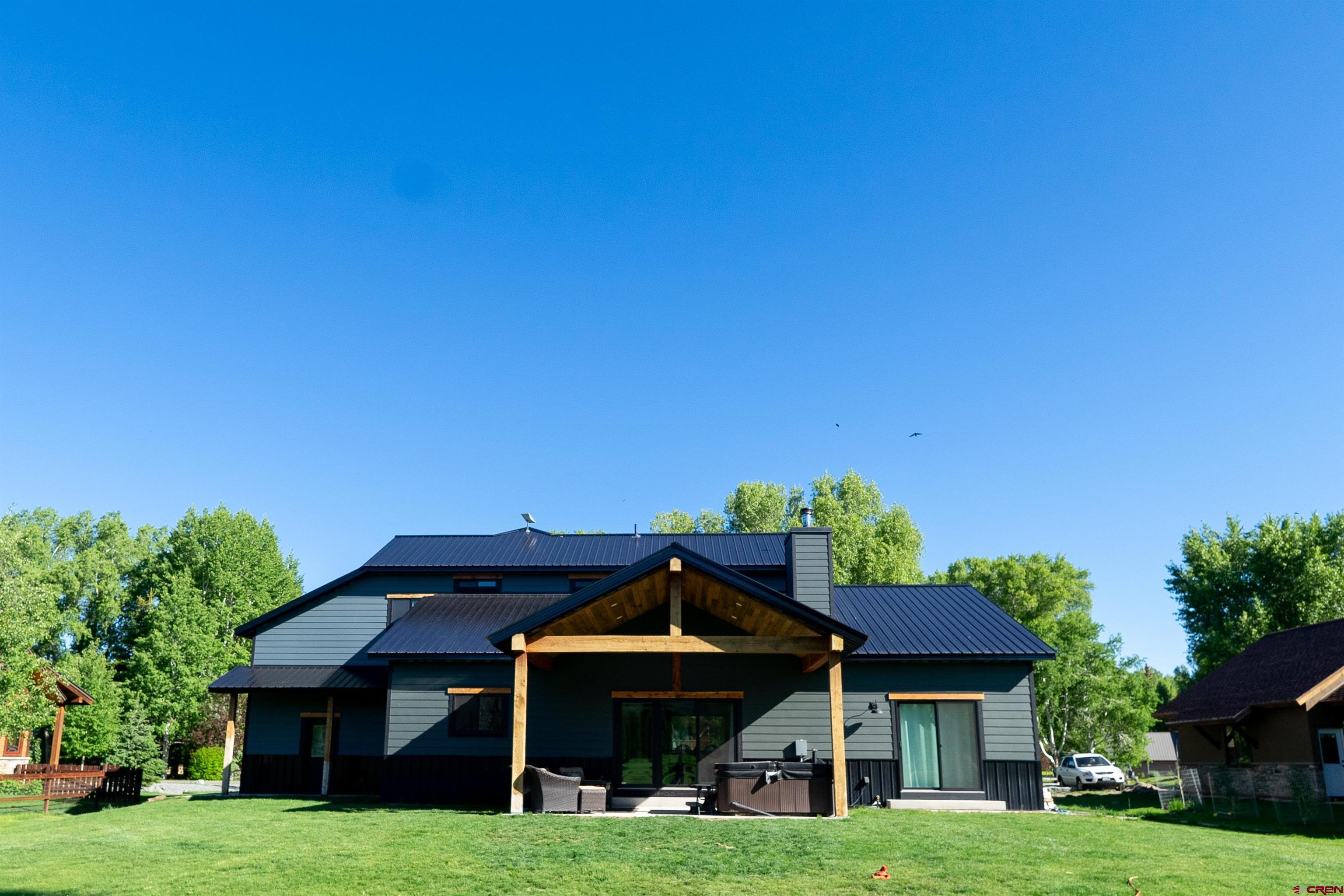 382 Tomichi Trail Gunnison, CO 81230 - Photo 3 of 34 a front view of a house with garden