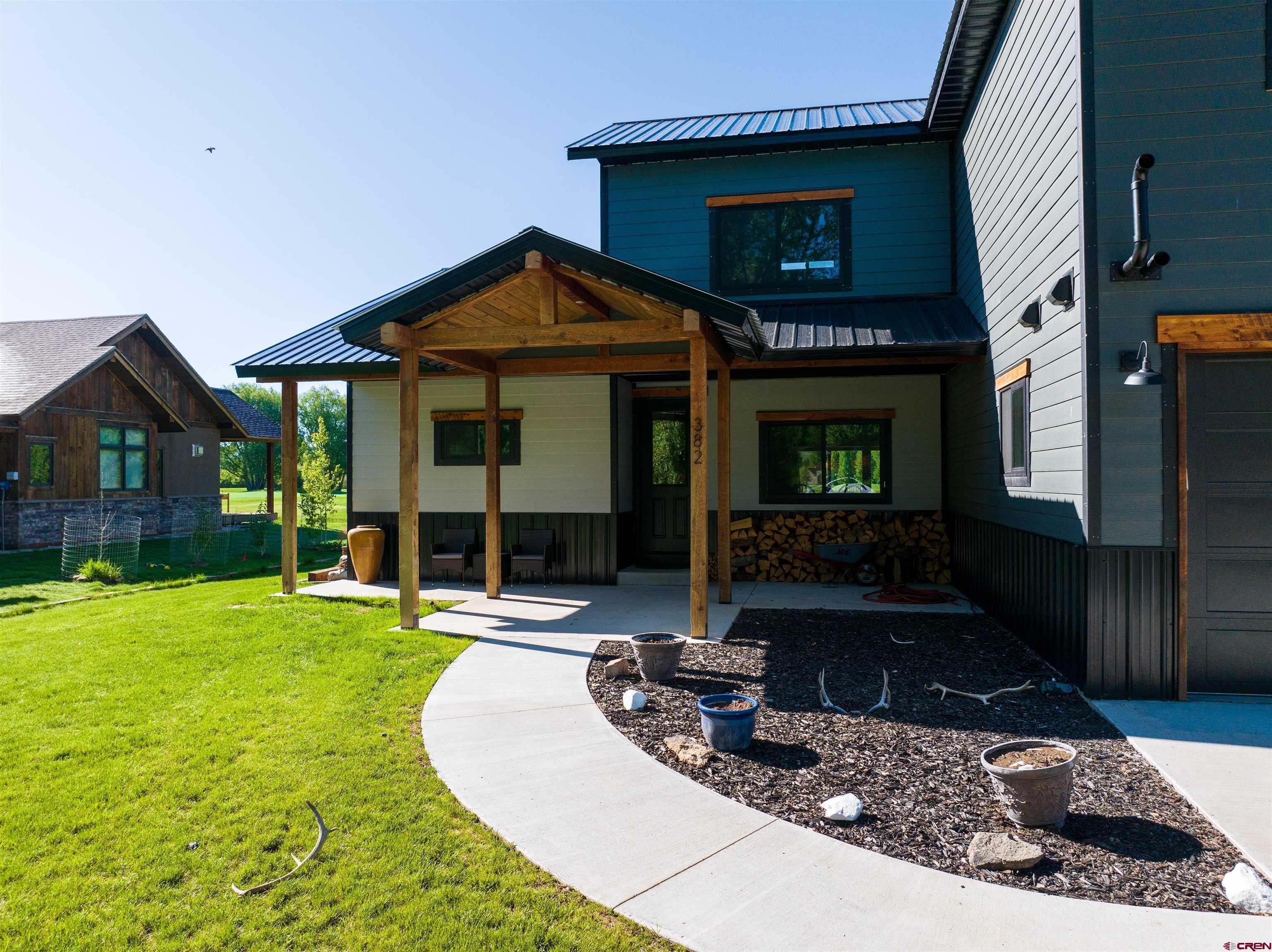 382 Tomichi Trail Gunnison, CO 81230 - Photo 4 of 34 a view of a house with backyard and porch