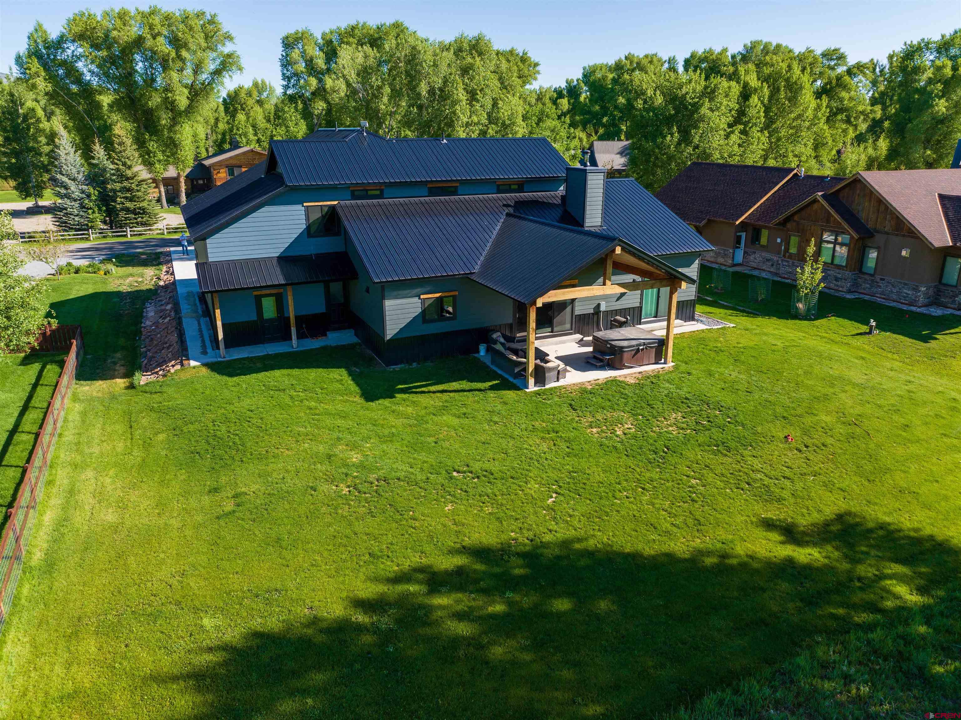 382 Tomichi Trail Gunnison, CO 81230 - Photo 5 of 34 a front view of house with yard and green space
