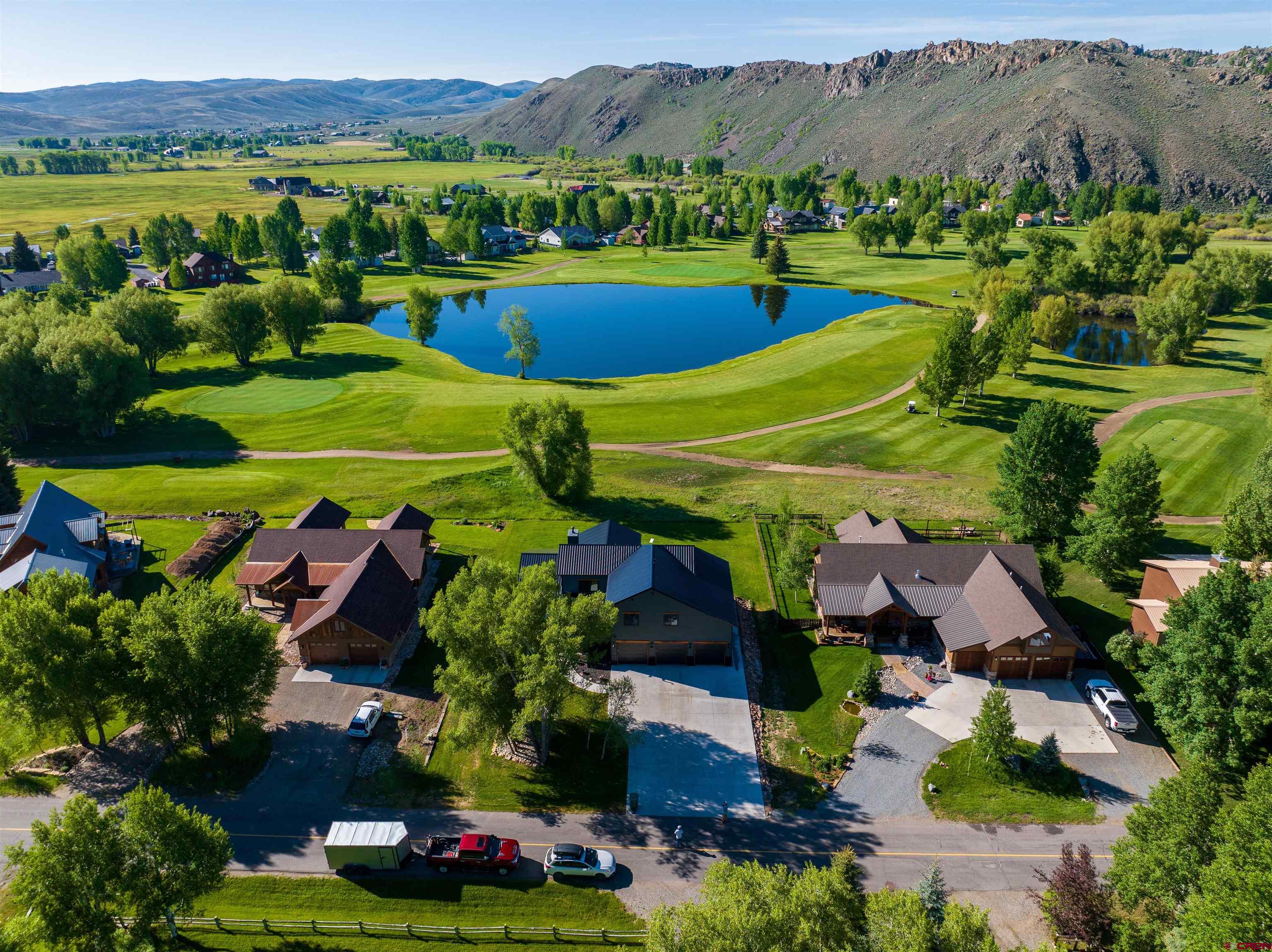 382 Tomichi Trail Gunnison, CO 81230 - Photo 7 of 34 an aerial view of a house with a garden and lake view