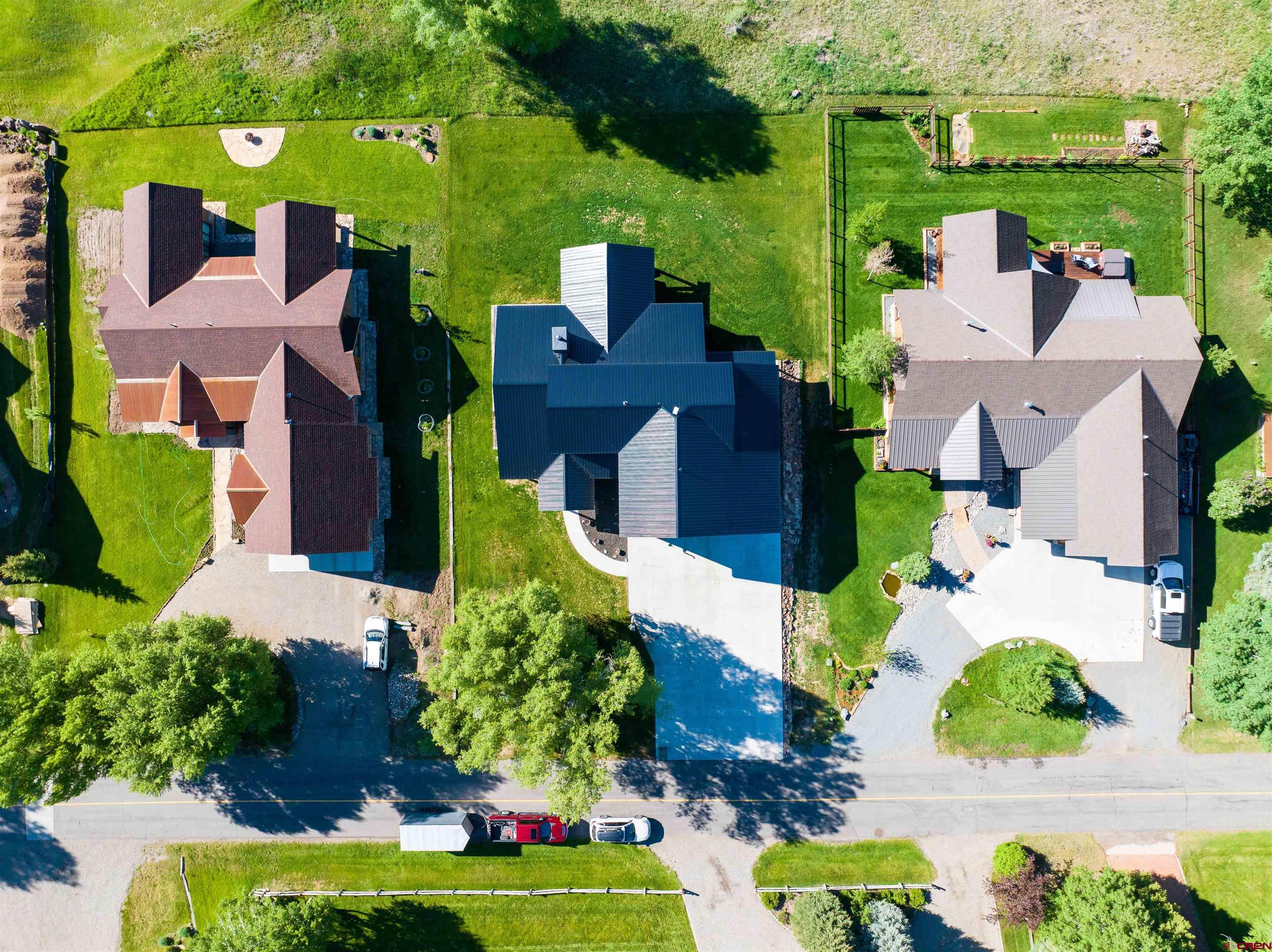 382 Tomichi Trail Gunnison, CO 81230 - Photo 10 of 34 an aerial view of a house with a garden and lake view