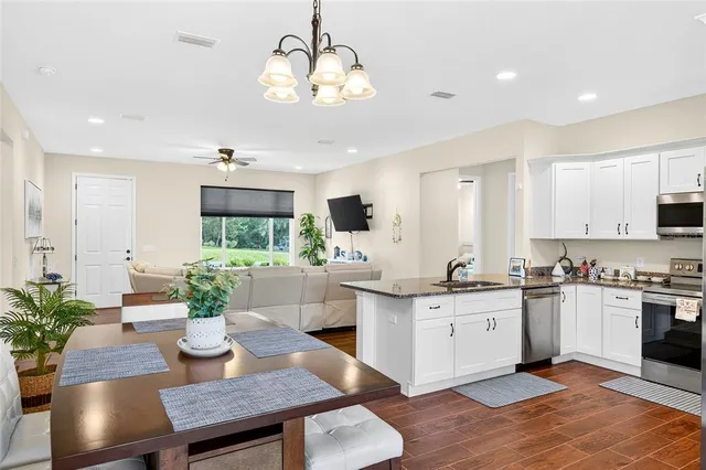 a kitchen with sink and center island