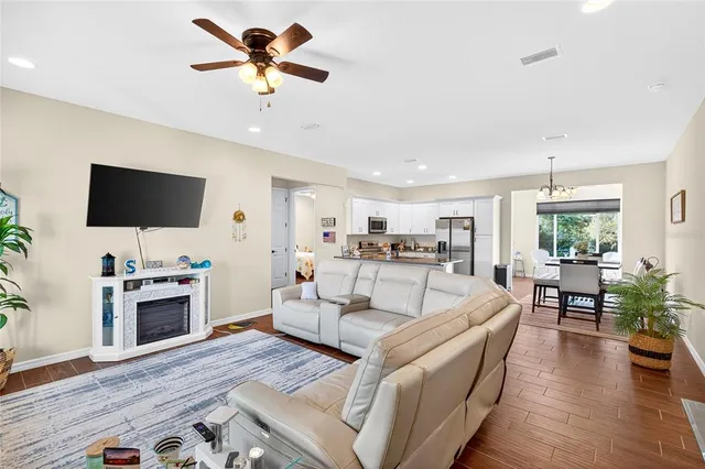 a living room with furniture fireplace and flat screen tv