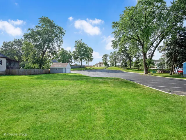a view of a house with a big yard