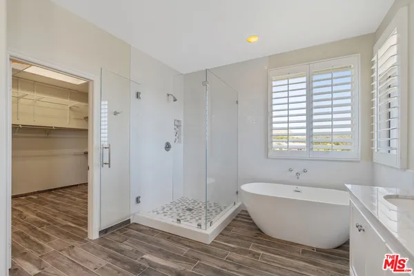 a bathroom with a bathtub and a sink