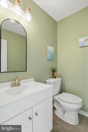 a en suite bathroom with a double vanity sink and a mirror