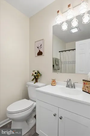 an empty room with a ceiling fan and carpet