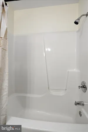 a view of a room with wooden walls