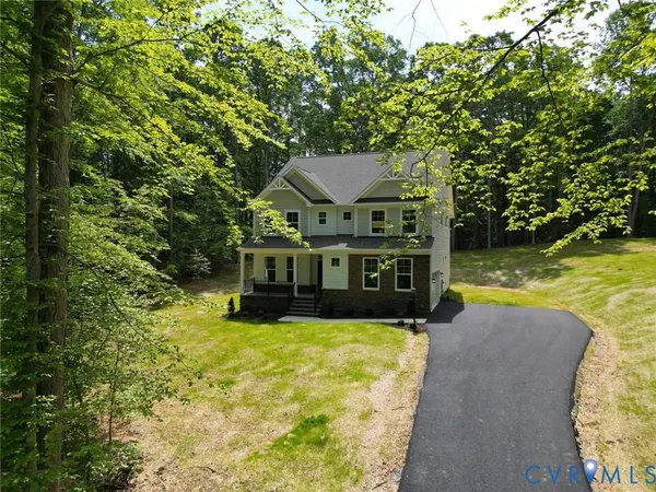 a view of a house with swimming pool and a yard