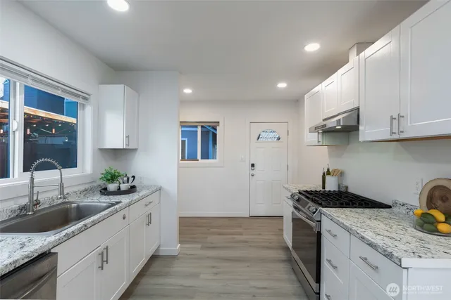 a view of a kitchen cabinets and window