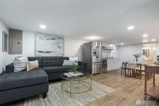 a kitchen with stainless steel appliances kitchen island granite countertop a sink and cabinets