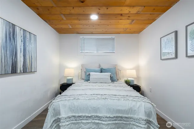 a bedroom with a bed and a walk in closet