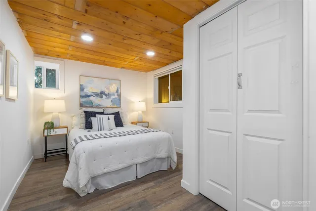 a bedroom with a bed and a view of bathroom