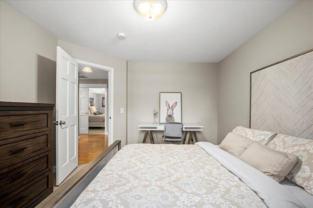 9 Auburn Road Millbury, MA 01527 - Photo 15 of 42 a bedroom with a bed and wooden floor
