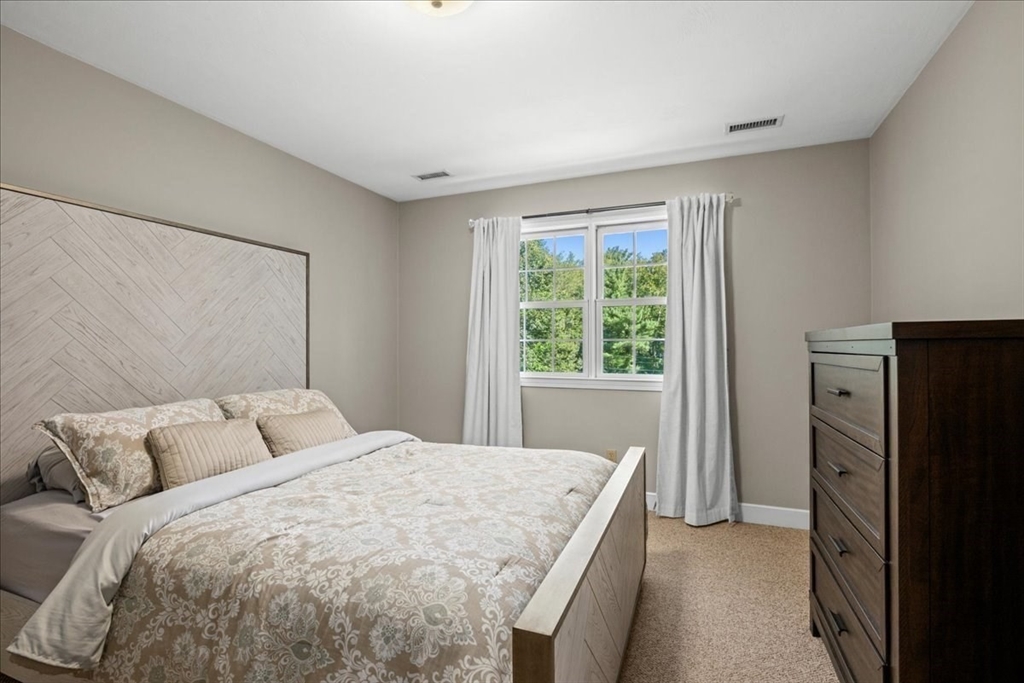 9 Auburn Road Millbury, MA 01527 - Photo 16 of 42 a bedroom with a bed and a window