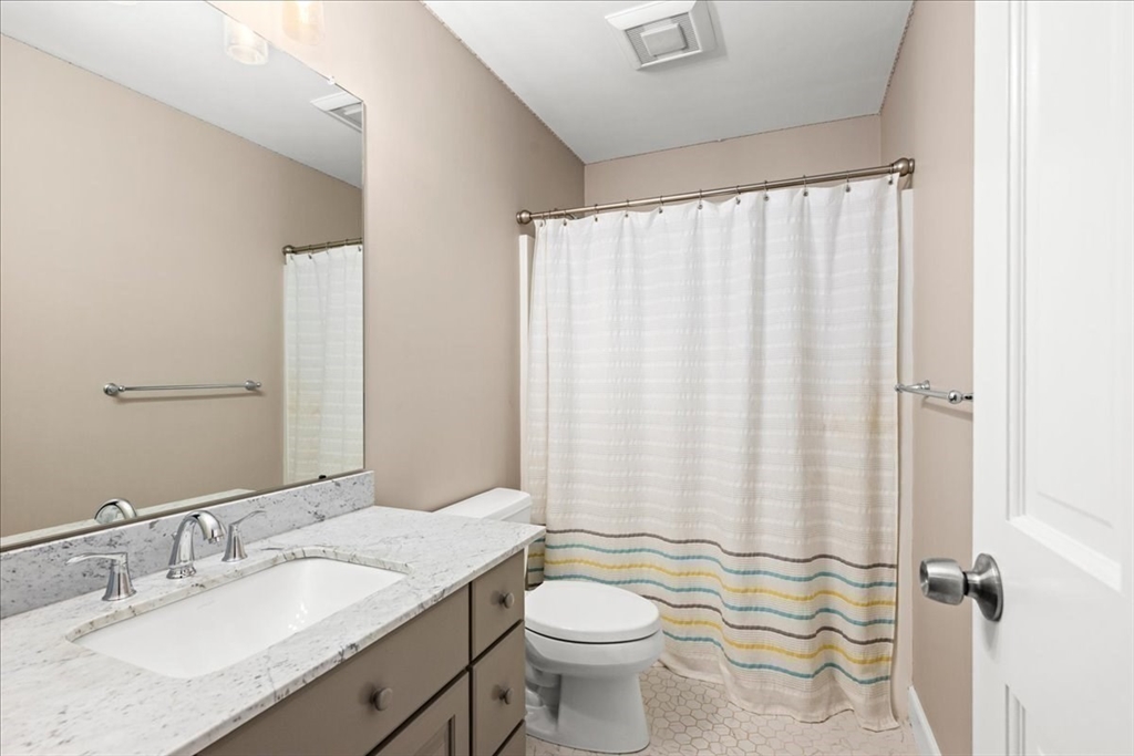 9 Auburn Road Millbury, MA 01527 - Photo 17 of 42 a bathroom with a granite countertop sink toilet and a mirror