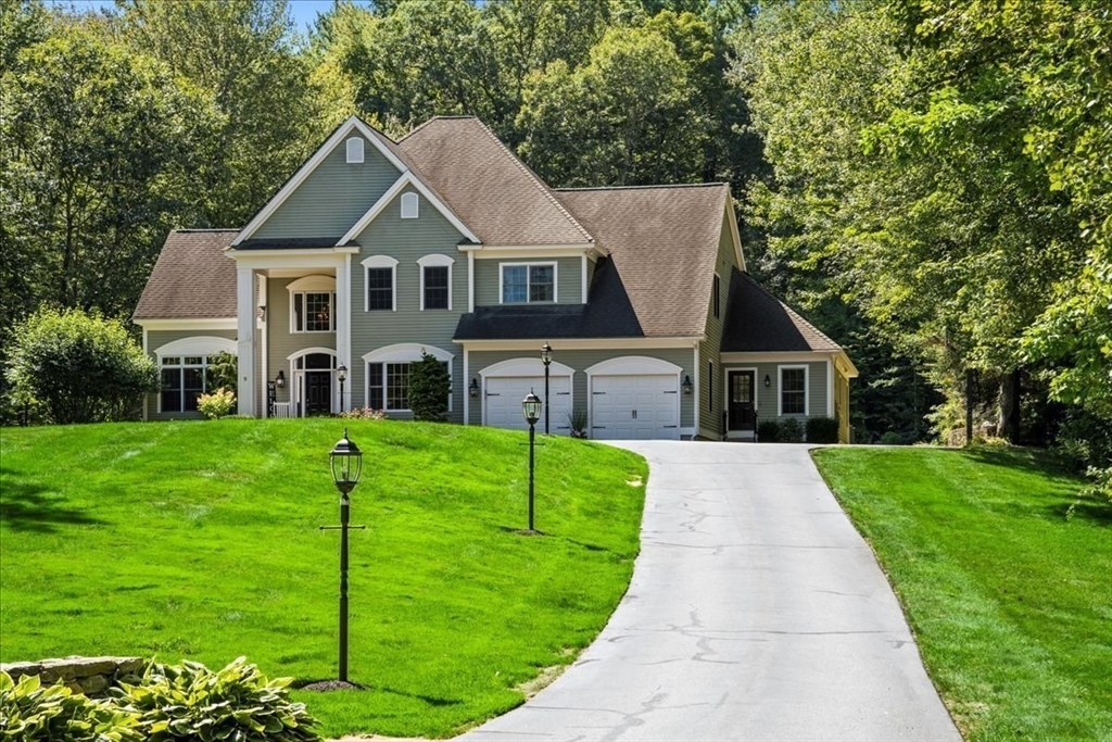 9 Auburn Road Millbury, MA 01527 - Photo 2 of 42 a front view of a house with garden