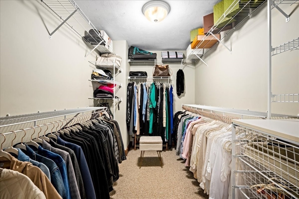 9 Auburn Road Millbury, MA 01527 - Photo 21 of 42 a view of walk in closet with clothes and shoes