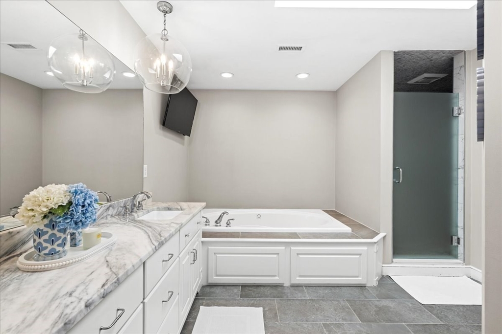 9 Auburn Road Millbury, MA 01527 - Photo 22 of 42 a bathroom with a tub sink and mirror