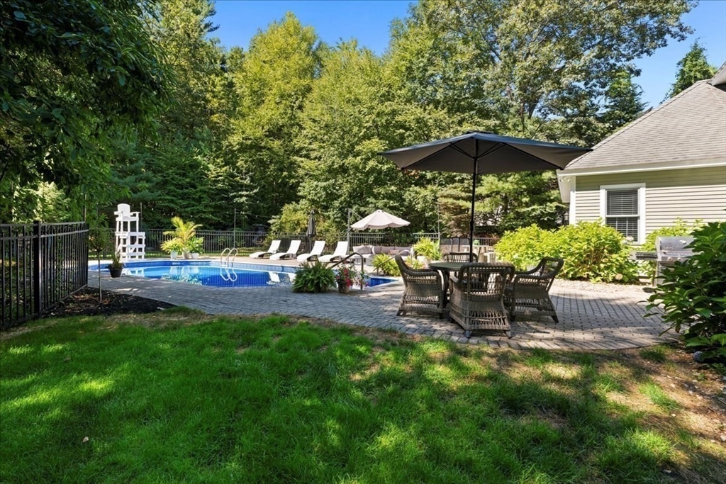 9 Auburn Road Millbury, MA 01527 - Photo 35 of 42 a view of a house with backyard sitting area and garden