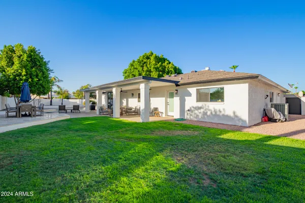 a view of yard with patio