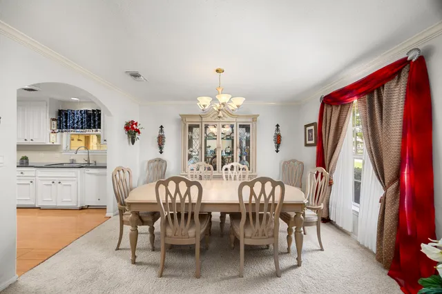 a view of a dining room with furniture window and outside view
