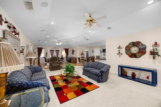 a living room with furniture rug and window