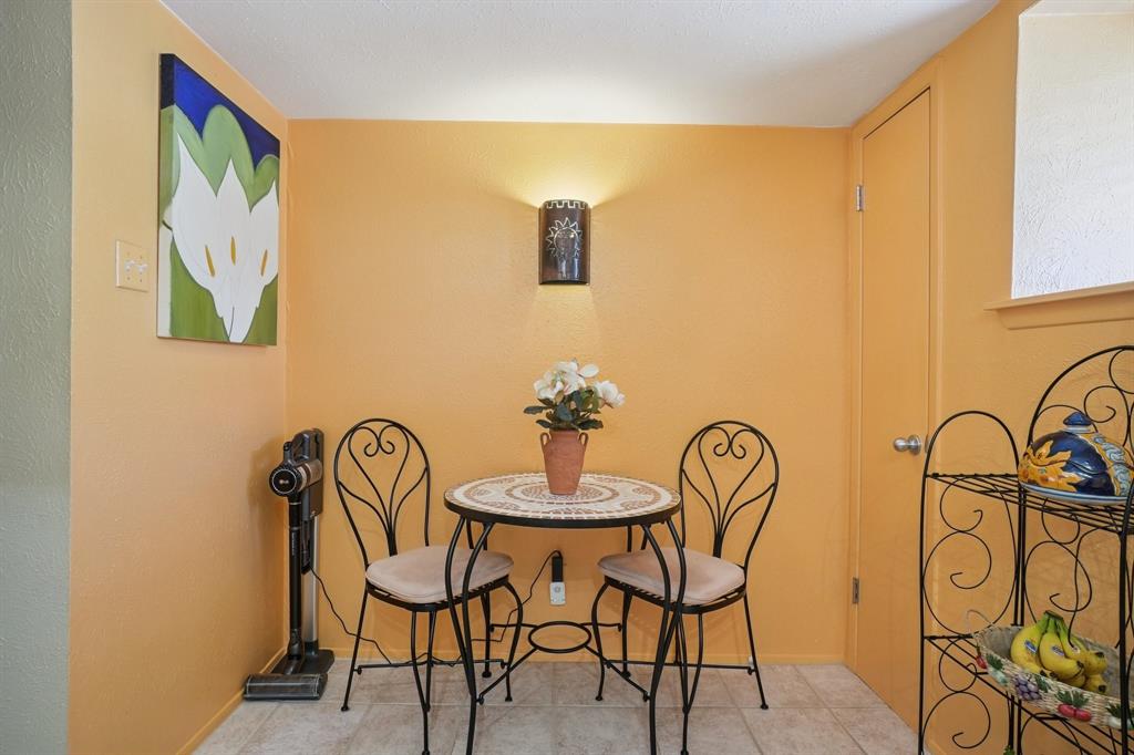 4569 North O'Connor Road, Unit 1319 Irving, TX 75062 - Photo 11 of 40 a view of a dining room with furniture and a potted plant