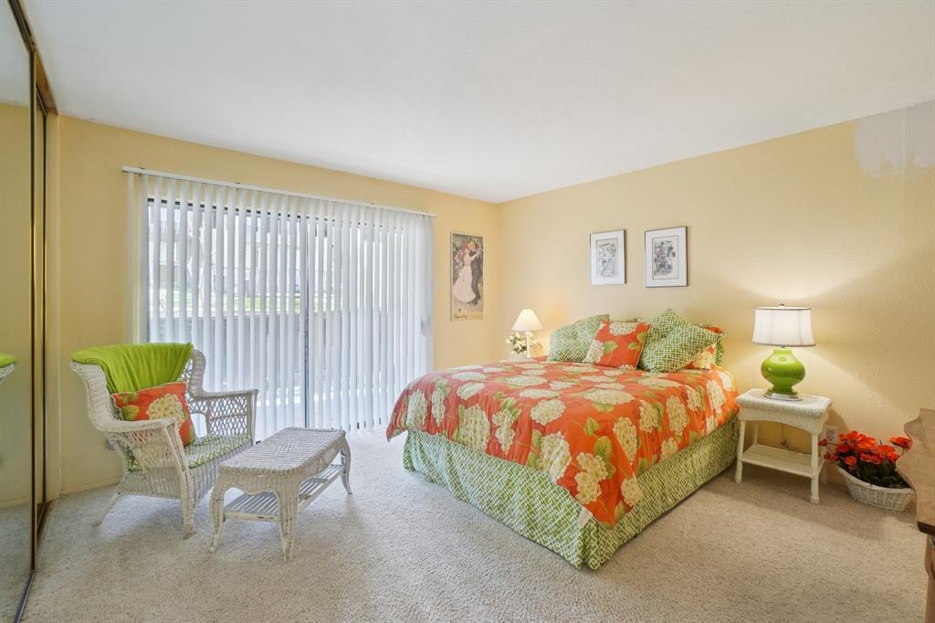 4569 North O'Connor Road, Unit 1319 Irving, TX 75062 - Photo 29 of 40 a bed room with a bed and chair