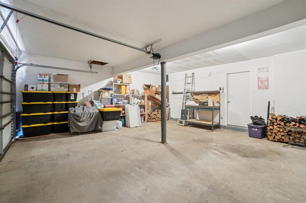 4569 North O'Connor Road, Unit 1319 Irving, TX 75062 - Photo 33 of 40 Spacious garage with additional storage