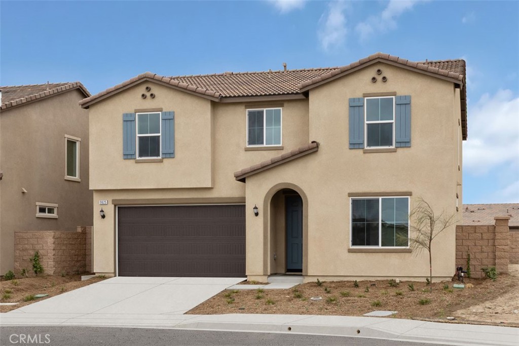 9625 Corcovado Way Riverside, CA 92508 - Photo 1 of 1 a front view of a house with a yard